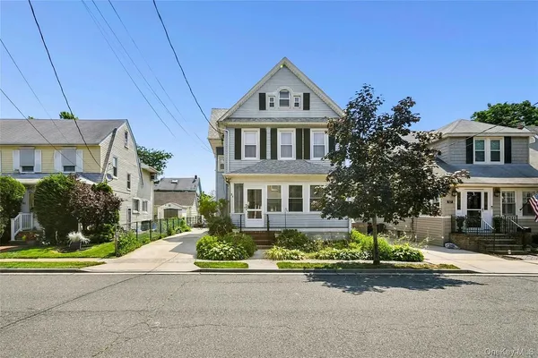 front view of a house with a street