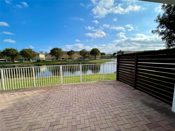 a view of park with wooden fence