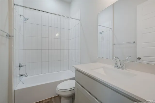 a bathroom with a sink a toilet and a bathtub