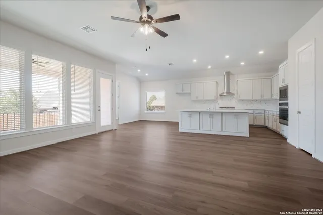 a view of kitchen with wooden floor and window