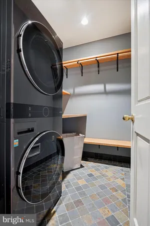 a bathroom with a sink mirror vanity and toilet