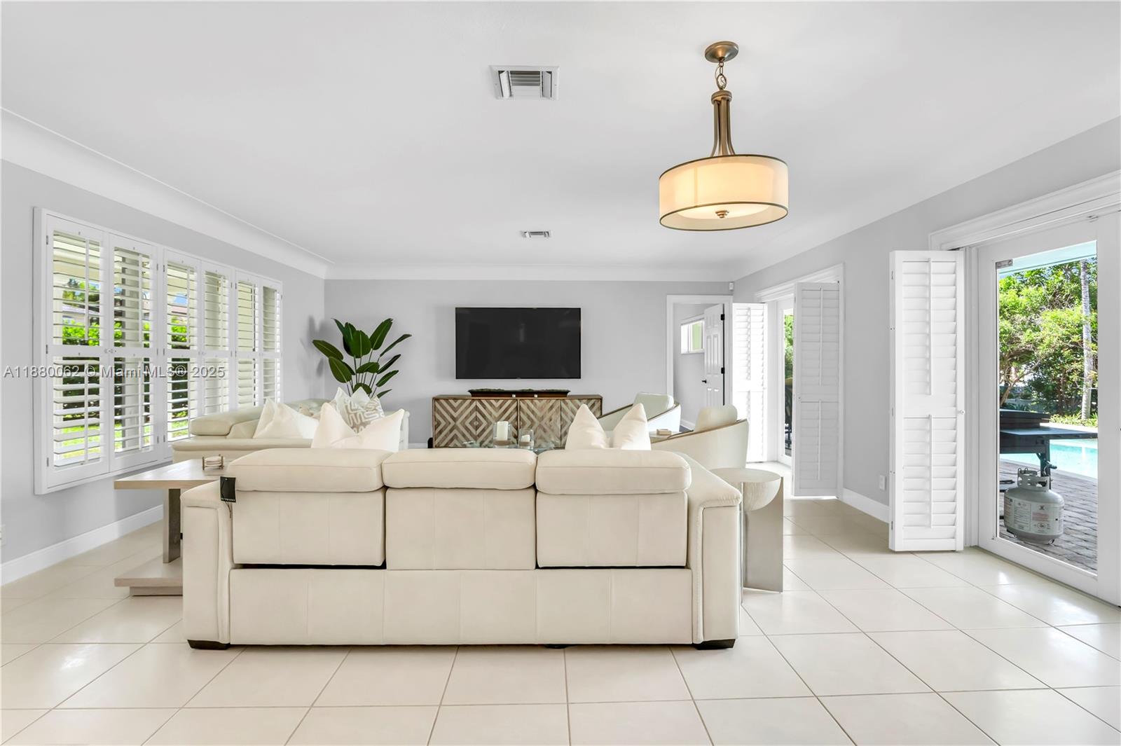 3921 Northeast 31st Avenue Lighthouse Point, FL 33064 - Photo 11 of 64 a living room with furniture and a large window
