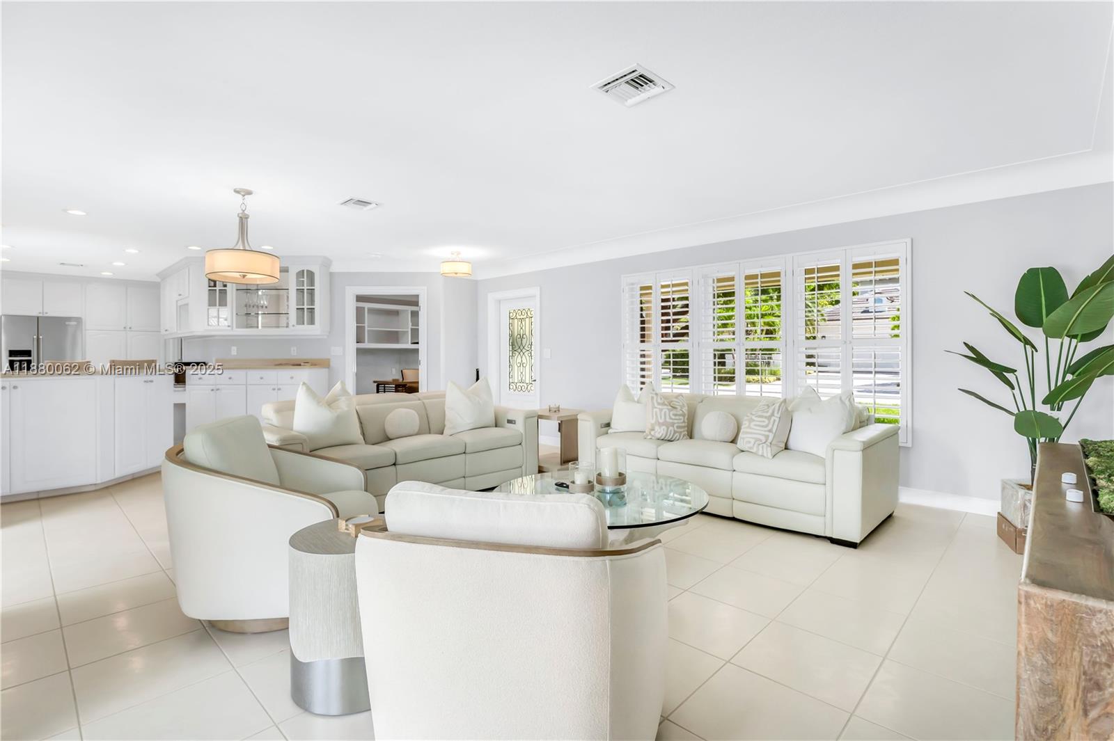 3921 Northeast 31st Avenue Lighthouse Point, FL 33064 - Photo 12 of 64 a living room with furniture and a large window
