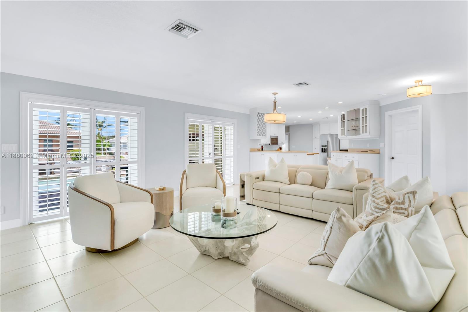 3921 Northeast 31st Avenue Lighthouse Point, FL 33064 - Photo 13 of 64 a living room with furniture and a large window
