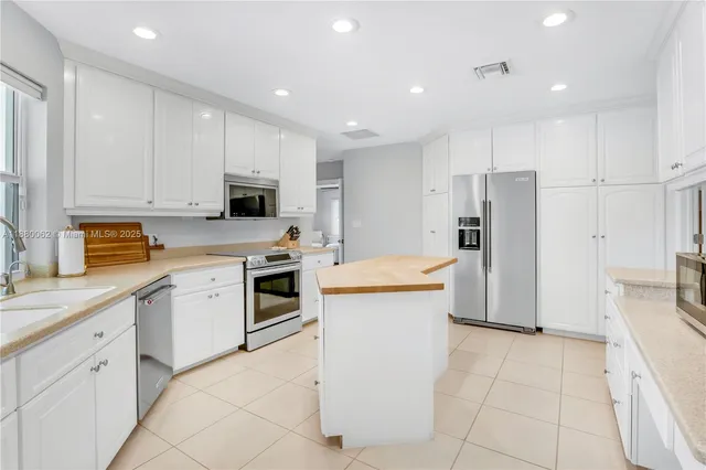 a bedroom with bed and wooden floor