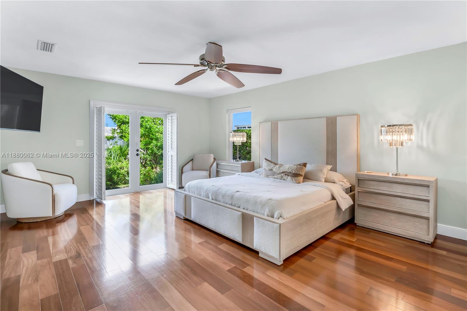 3921 Northeast 31st Avenue Lighthouse Point, FL 33064 - Photo 18 of 64 a spacious bedroom with a bed and a large window
