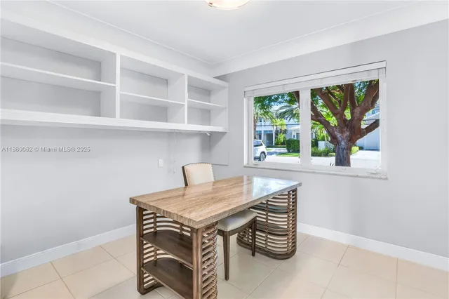 an aerial view of residential building and car parked