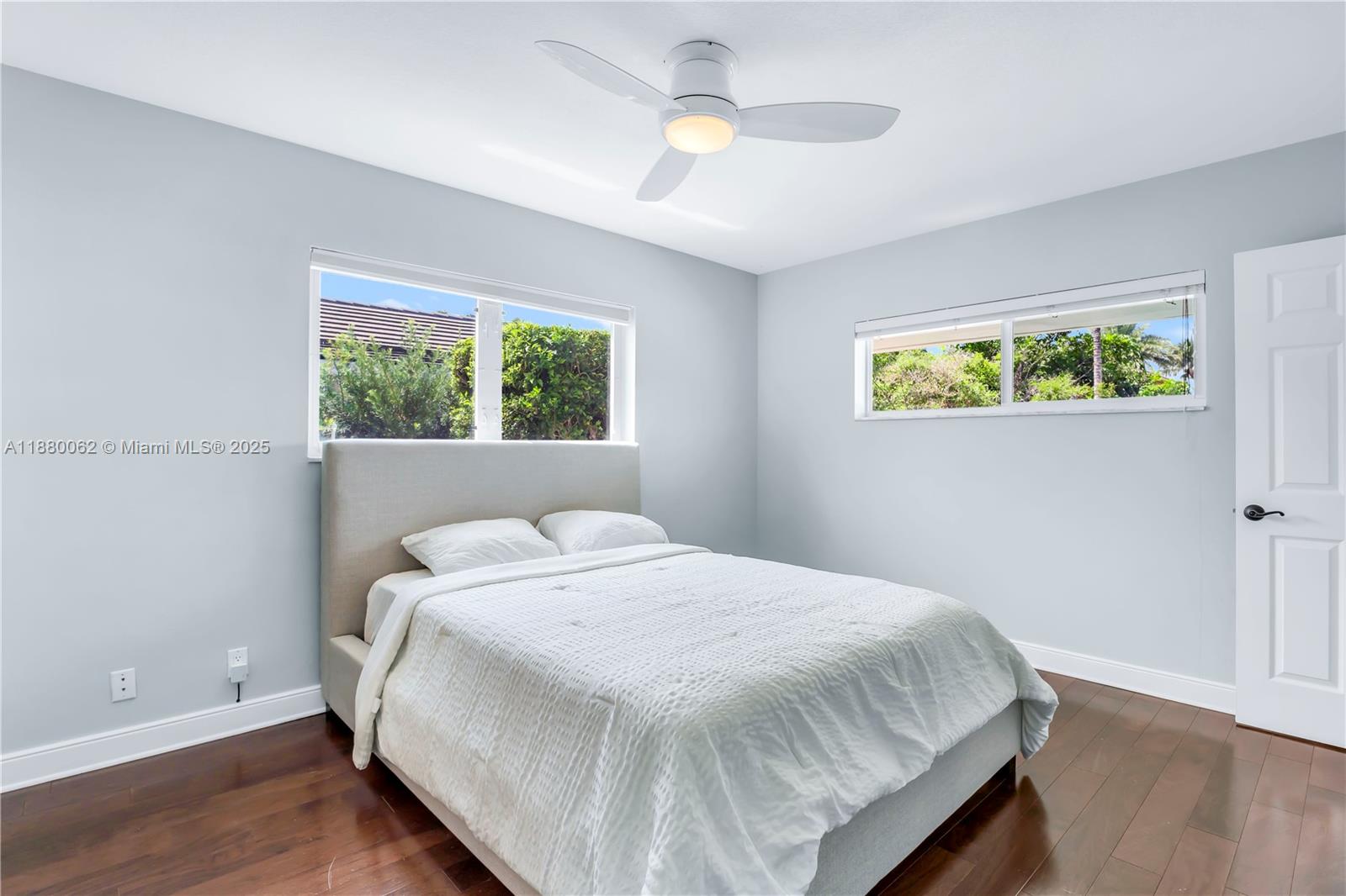 3921 Northeast 31st Avenue Lighthouse Point, FL 33064 - Photo 25 of 64 a bedroom with a bed and a window