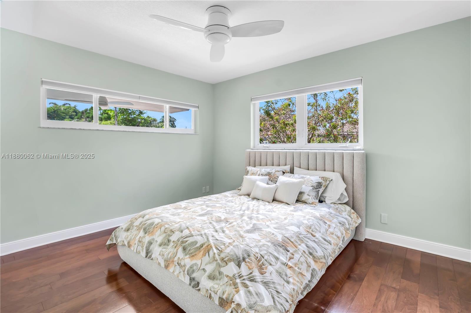 3921 Northeast 31st Avenue Lighthouse Point, FL 33064 - Photo 28 of 64 a bedroom with bed and wooden floor
