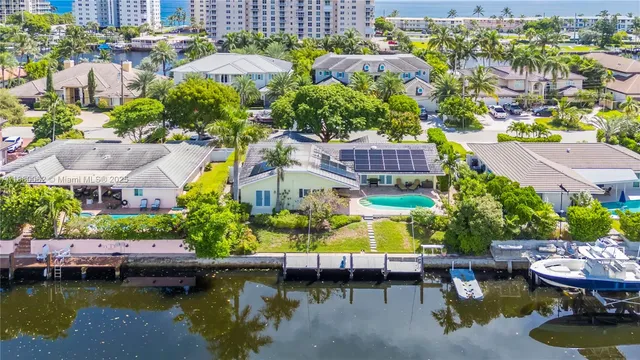 a swimming pool with outdoor seating and yard