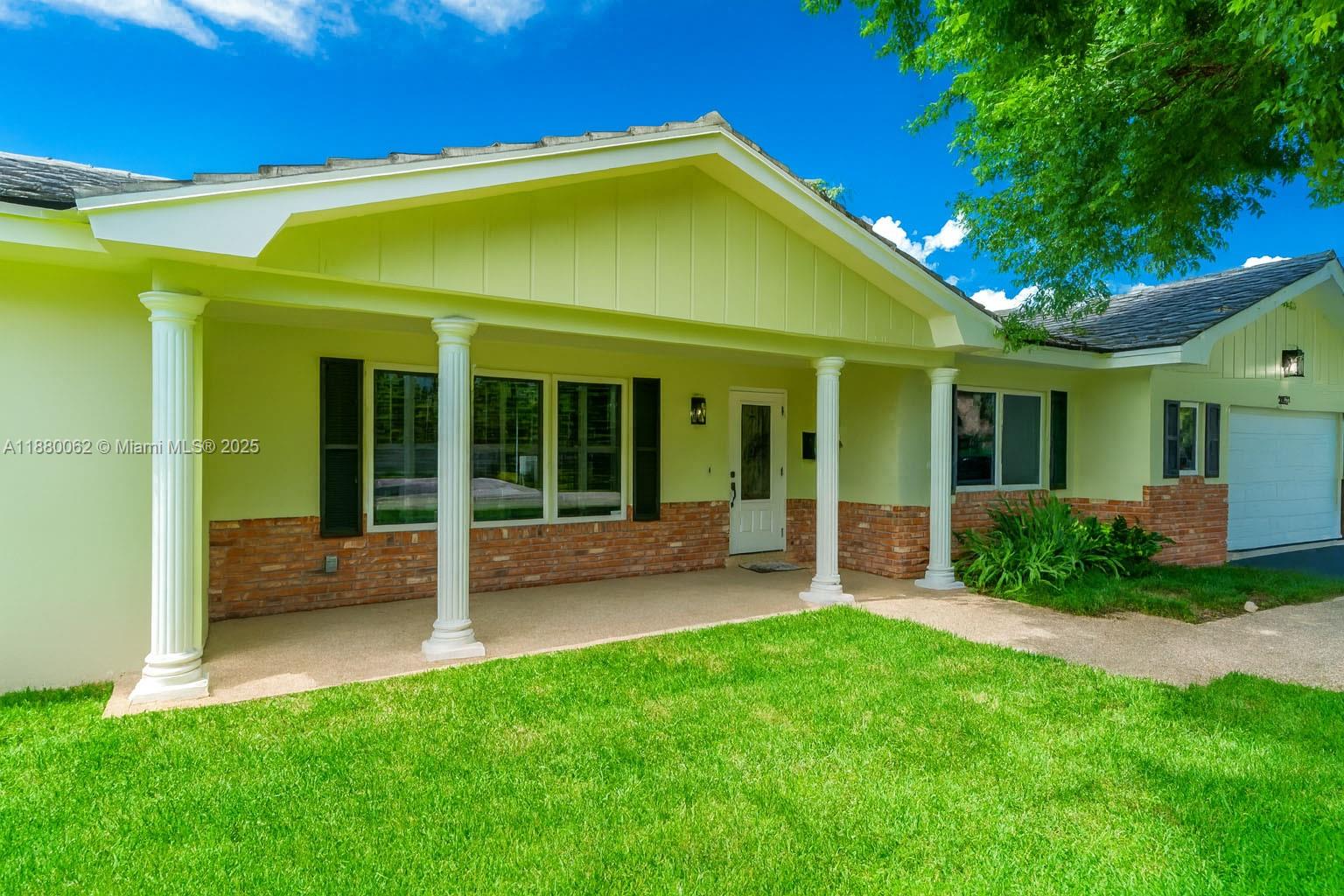 3921 Northeast 31st Avenue Lighthouse Point, FL 33064 - Photo 47 of 64 a view of a house with a yard porch and sitting area