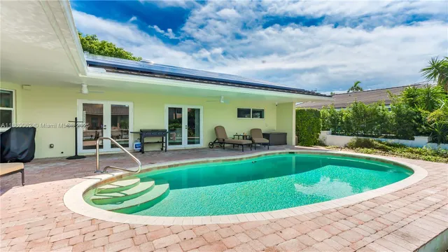 a living room with a couch and a flat screen tv