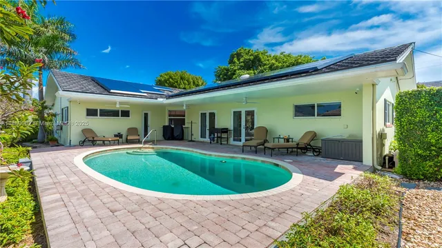 a spacious bedroom with a bed and a large window