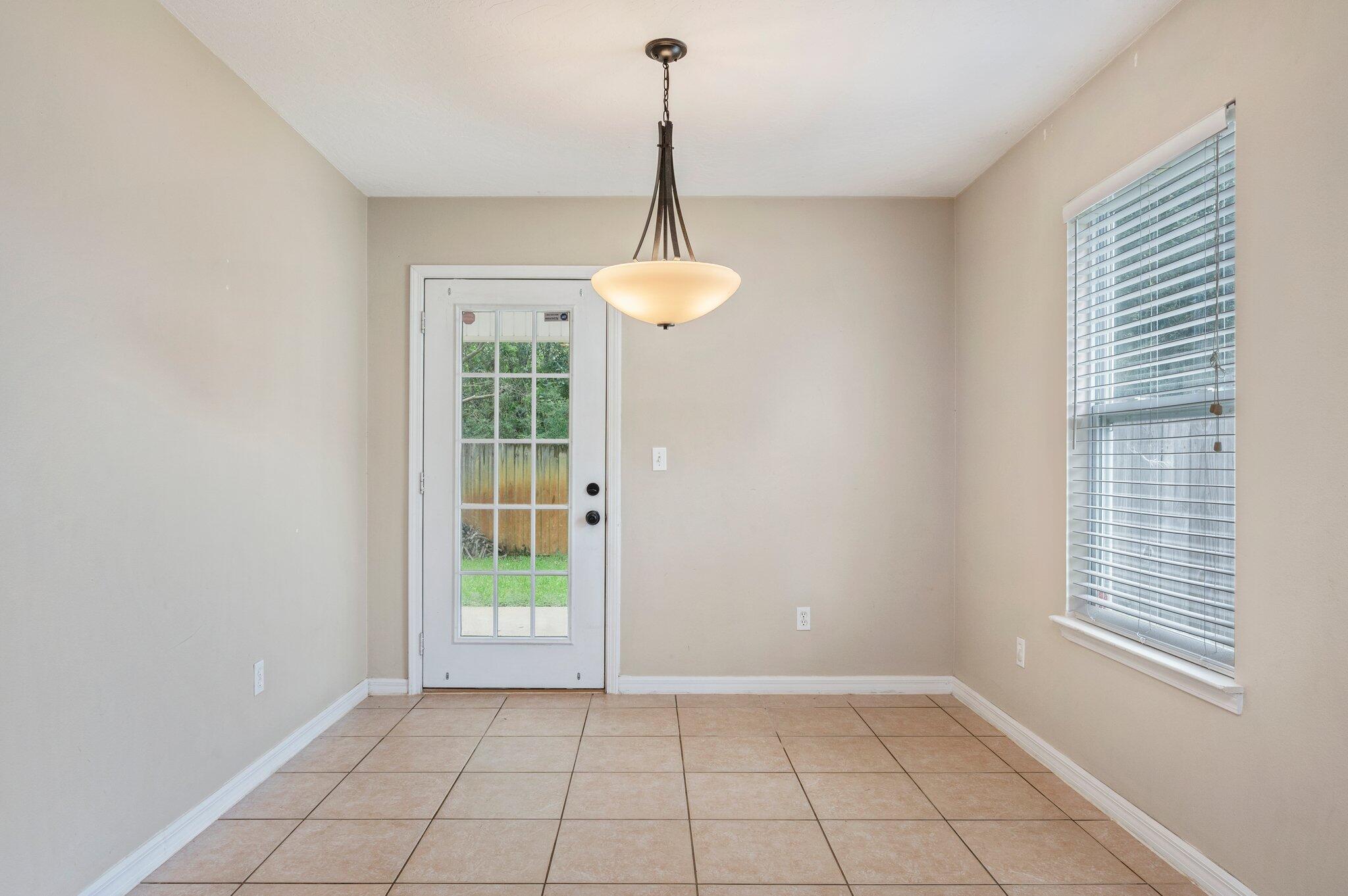 7 Snook Road Mary Esther, FL 32569 - Photo 17 of 38 a view of an empty room with a window