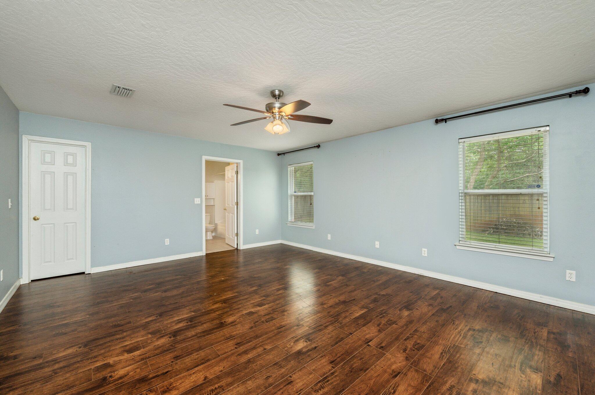 7 Snook Road Mary Esther, FL 32569 - Photo 24 of 38 a view of an empty room with a window and wooden floor