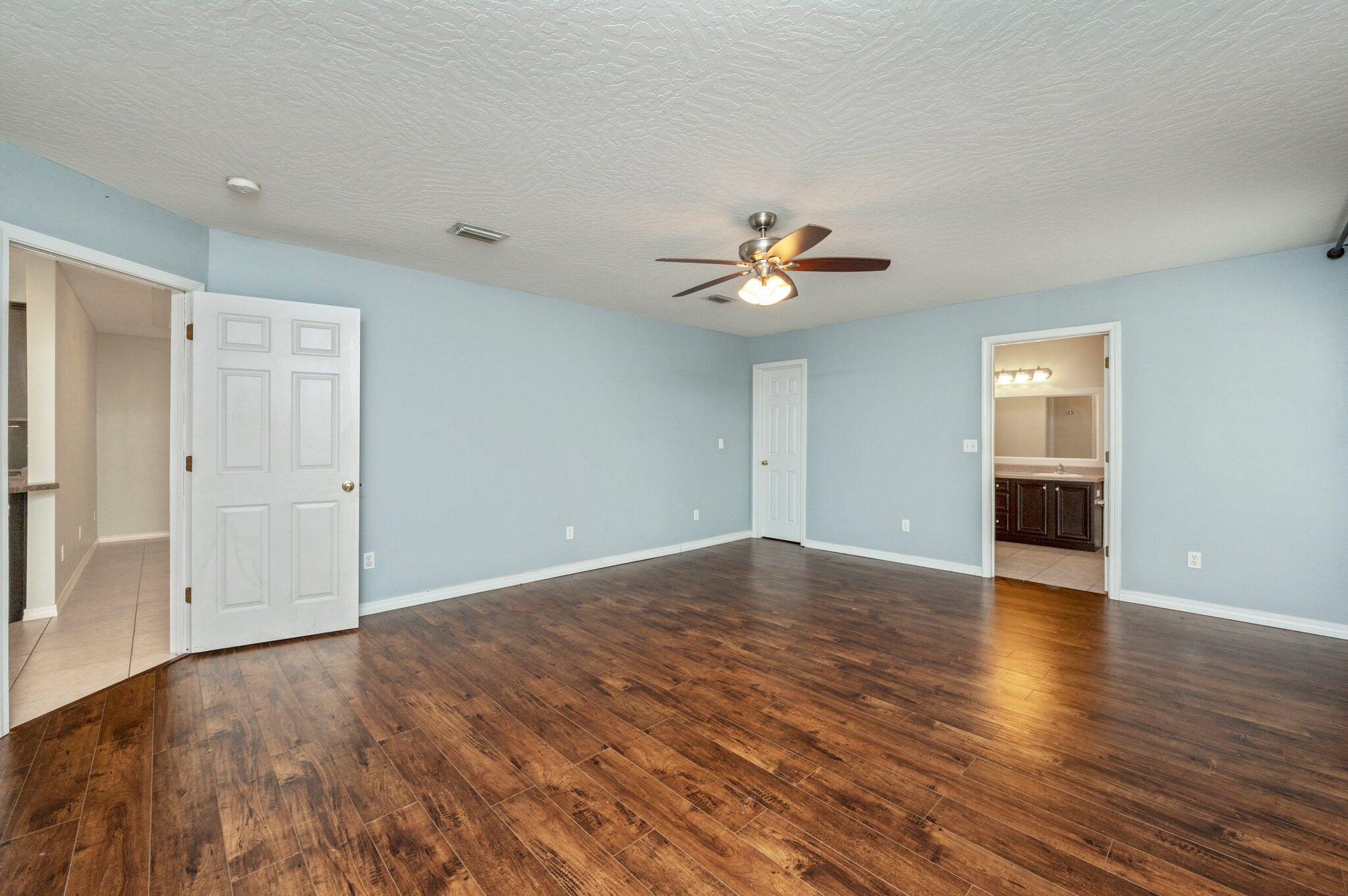 7 Snook Road Mary Esther, FL 32569 - Photo 25 of 38 a view of an empty room with wooden floor