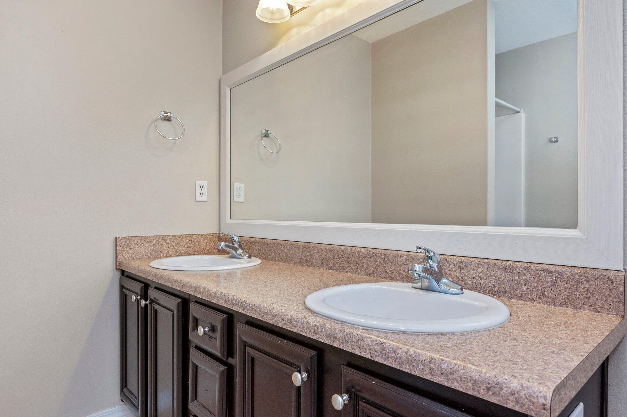 7 Snook Road Mary Esther, FL 32569 - Photo 28 of 38 a bathroom with a granite countertop sink and a mirror