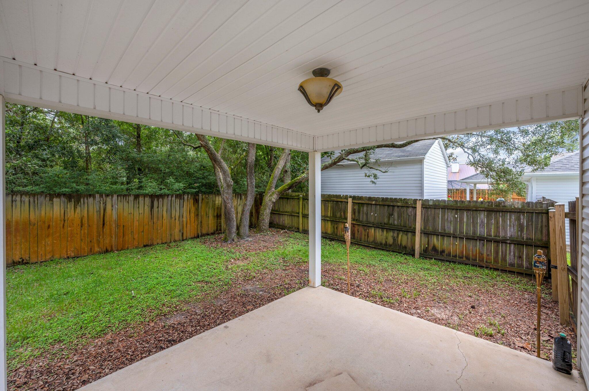 7 Snook Road Mary Esther, FL 32569 - Photo 32 of 38 a view of a backyard with a garden and plants