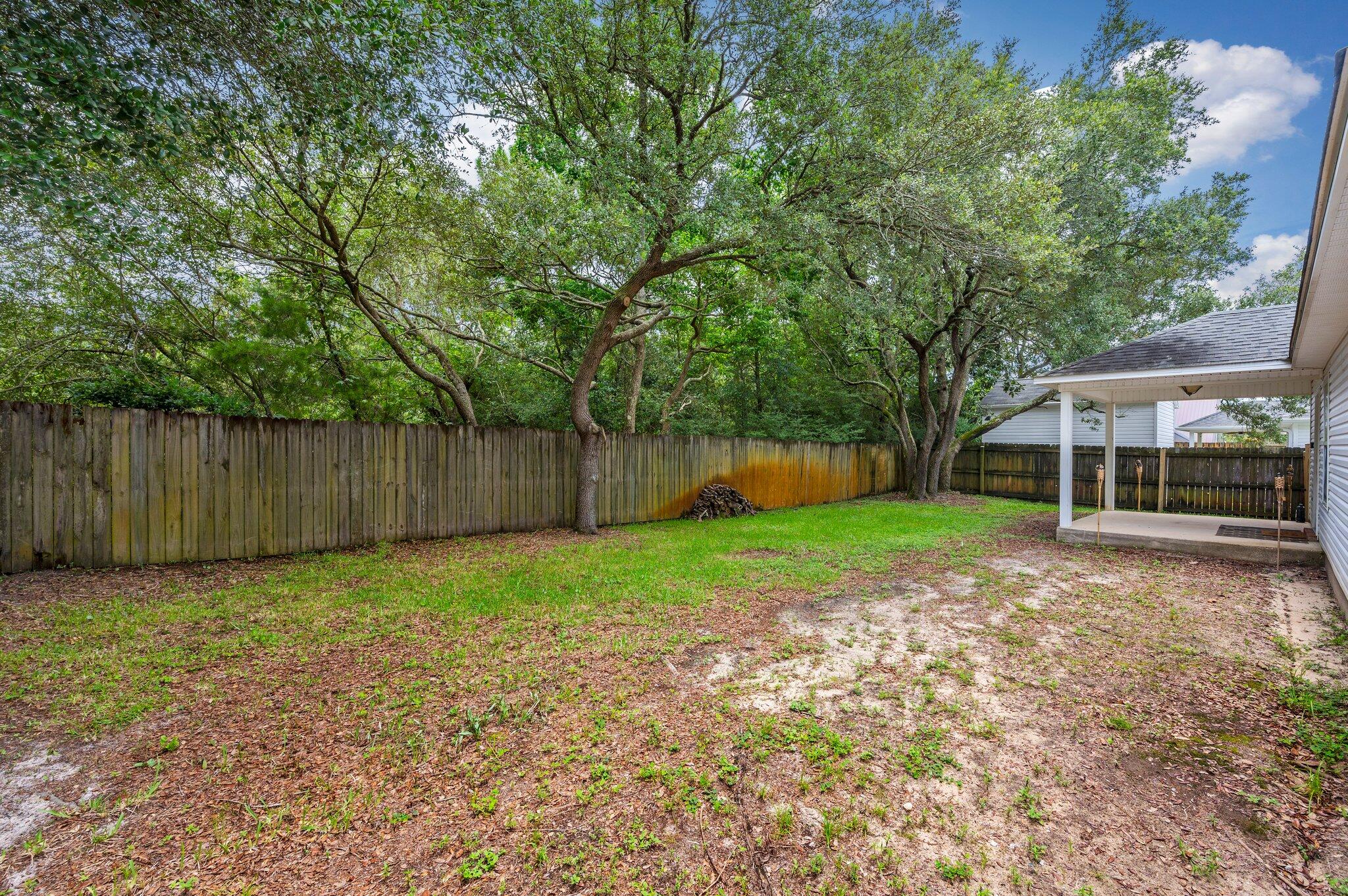 7 Snook Road Mary Esther, FL 32569 - Photo 34 of 38 a view of a yard with wooden fence