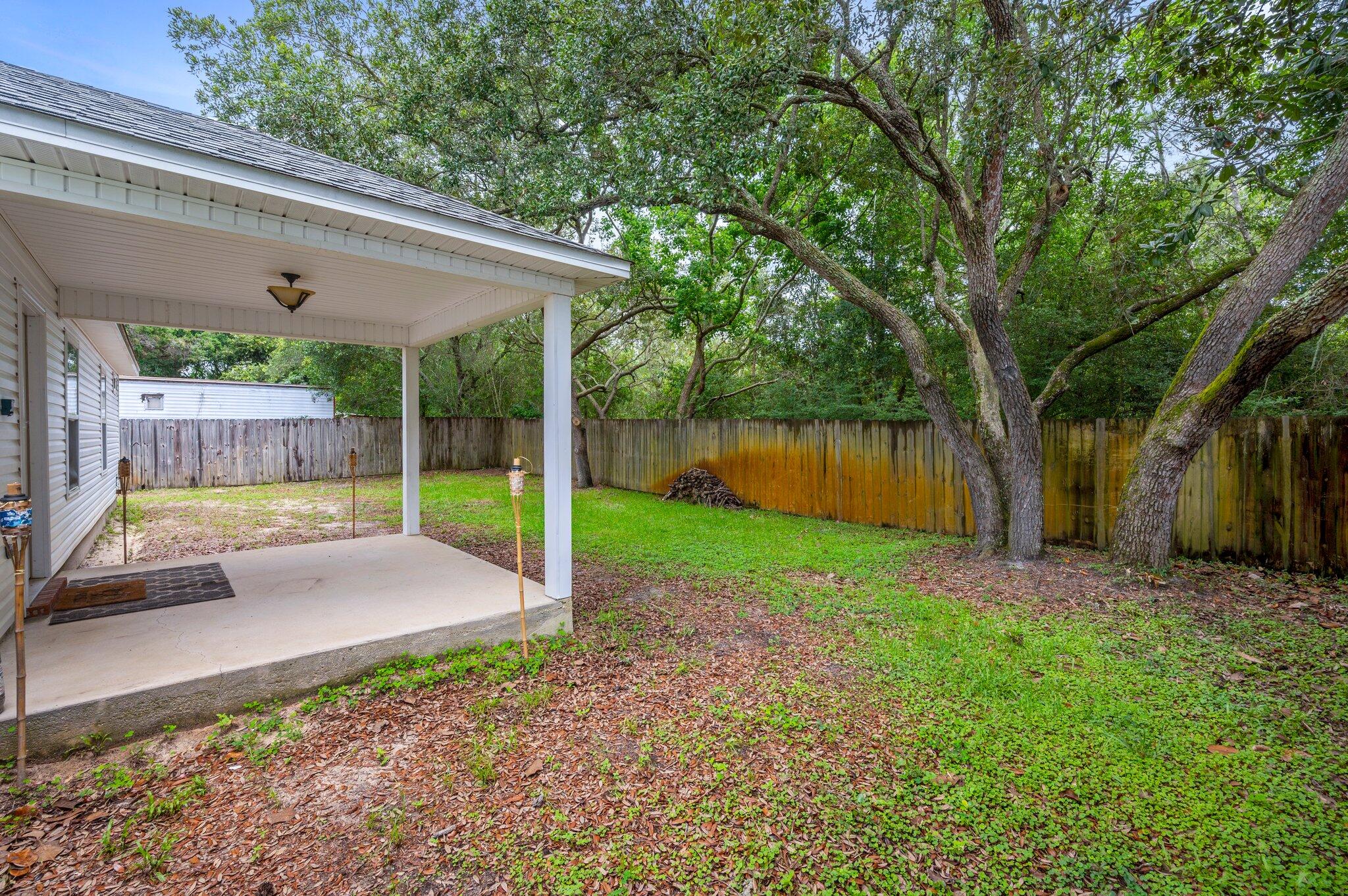 7 Snook Road Mary Esther, FL 32569 - Photo 38 of 38 a view of a patio with a backyard