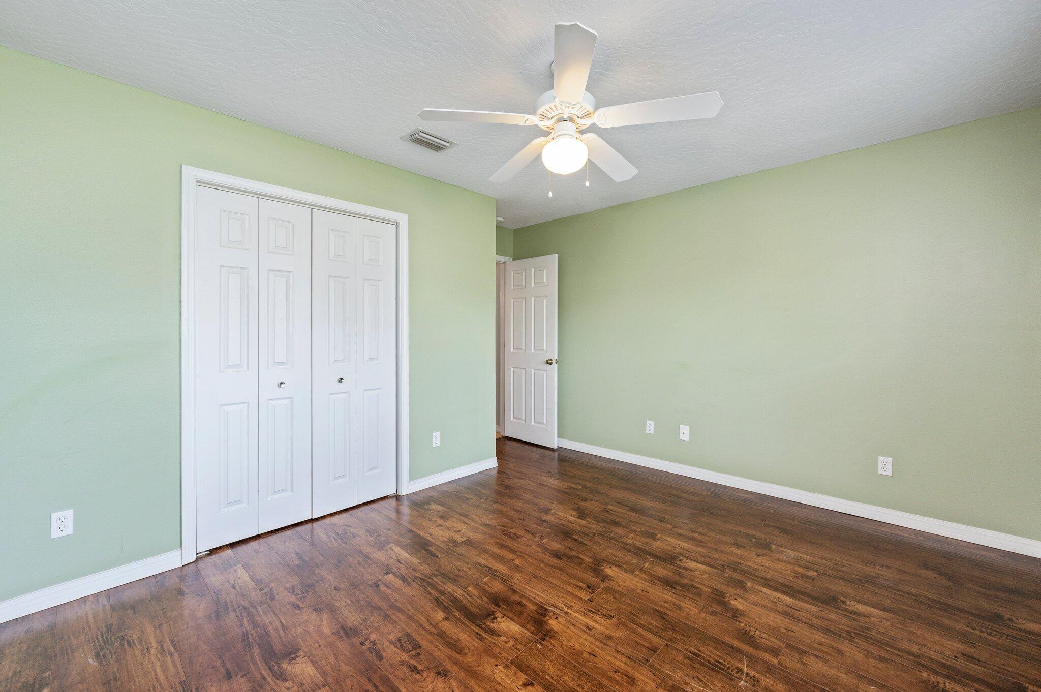7 Snook Road Mary Esther, FL 32569 - Photo 7 of 38 a view of an empty room with wooden floor