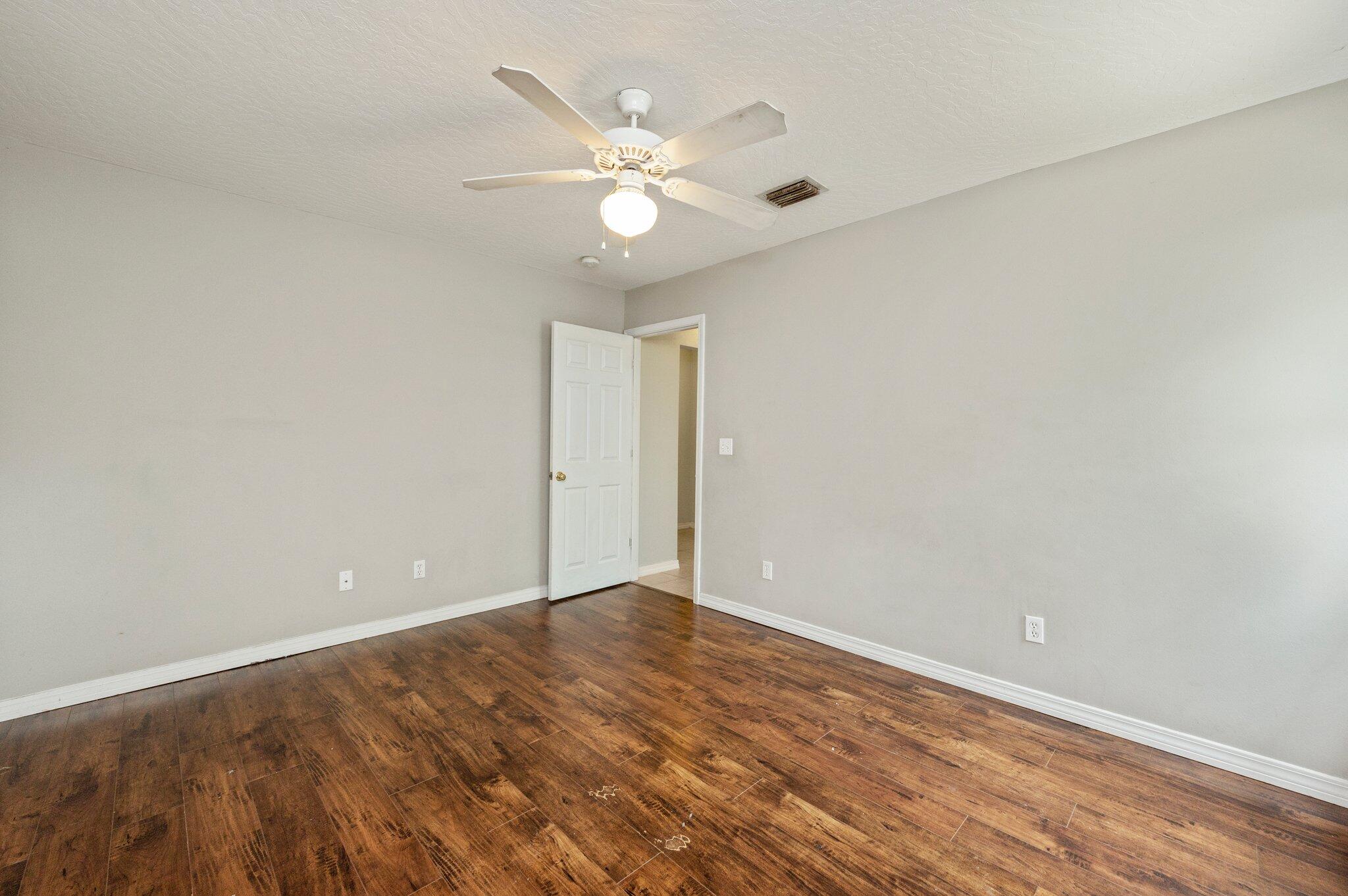 7 Snook Road Mary Esther, FL 32569 - Photo 9 of 38 a view of an empty room with wooden floor