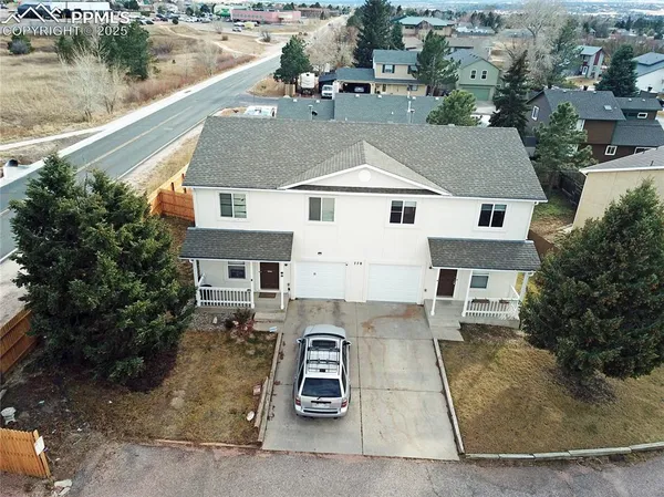 an aerial view of a house with lake view