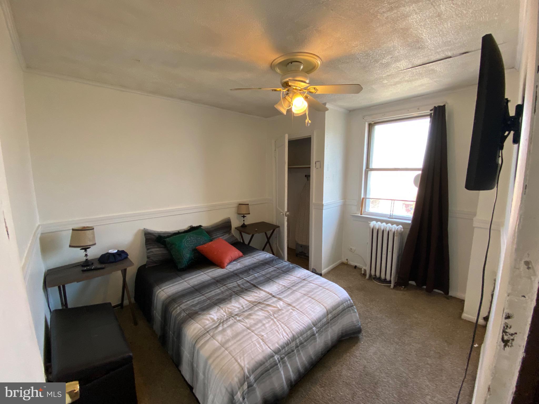 6993 Guilford Road Upper Darby, PA 19082 - Photo 13 of 21 Cozy bedroom with natural light and charm.