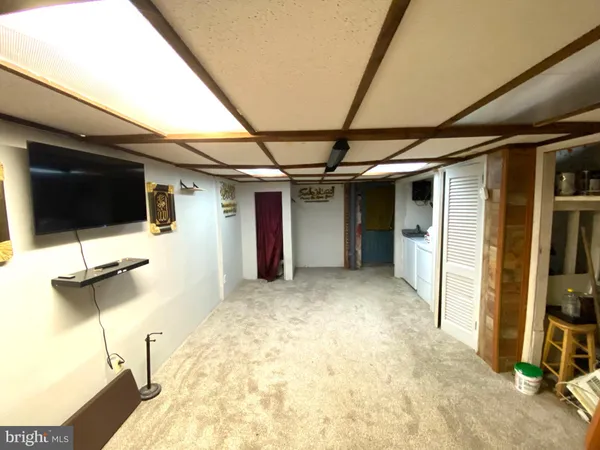 a view of a balcony with wooden floor and fence