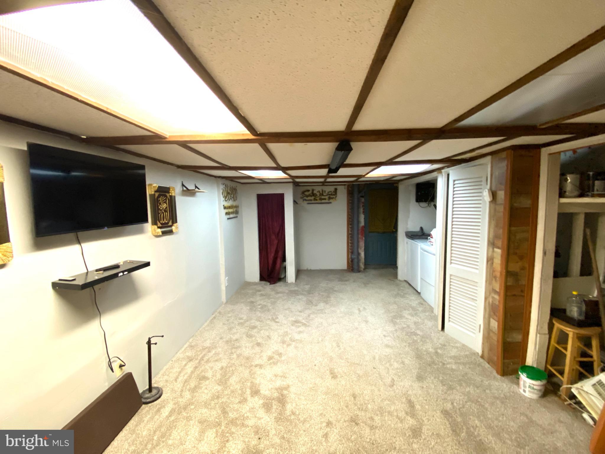 6993 Guilford Road Upper Darby, PA 19082 - Photo 17 of 21 Versatile basement space with cozy ambiance.