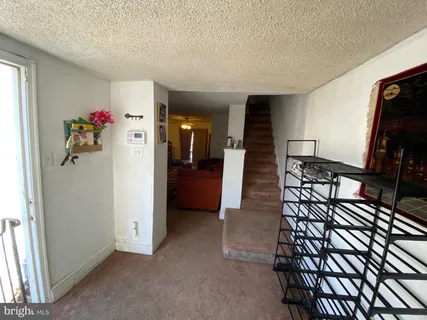 a view of entryway with livingroom