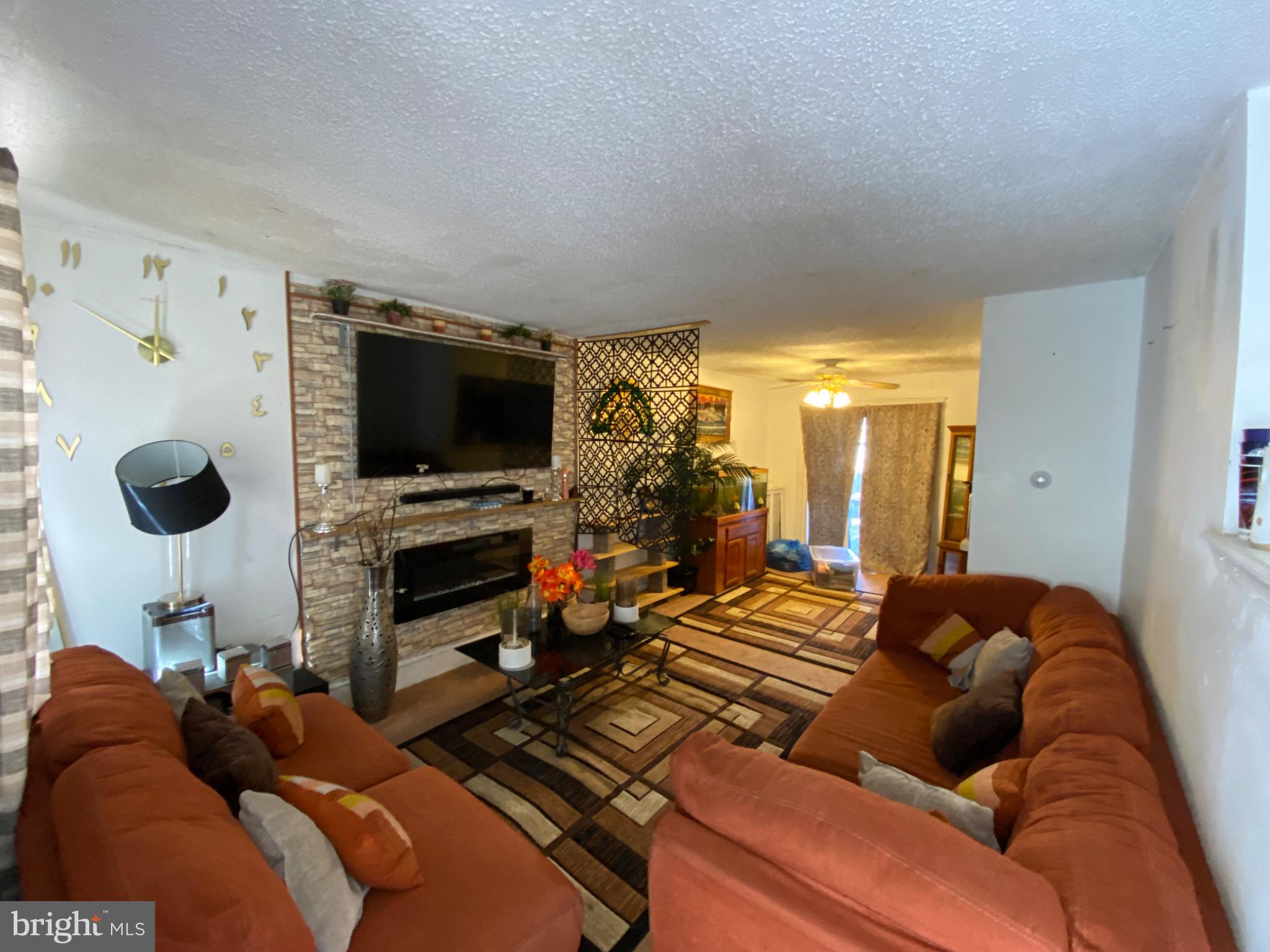 6993 Guilford Road Upper Darby, PA 19082 - Photo 5 of 21 Cozy living space with warm, inviting tones.