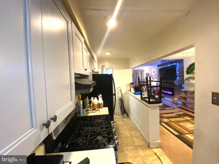 a kitchen with a stove and a sink