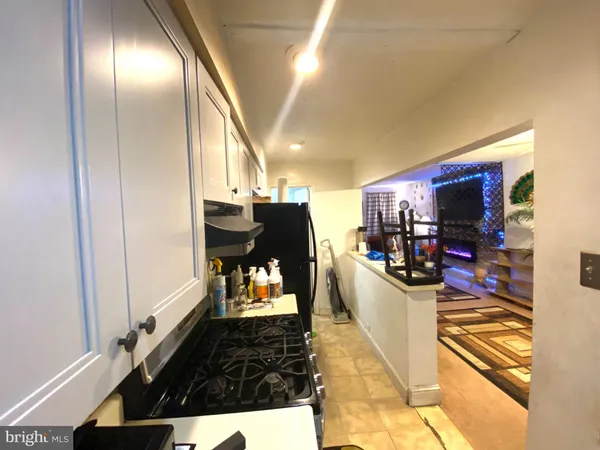 a kitchen with a stove and a sink