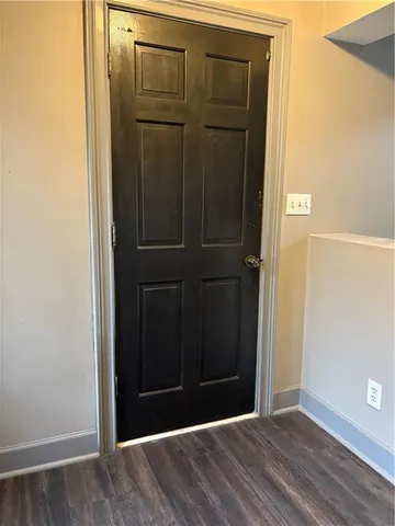 an empty room with wooden floor