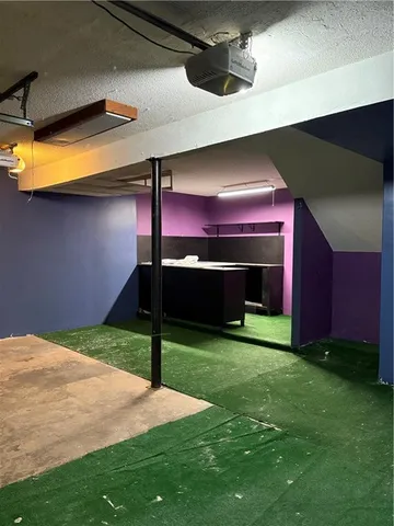 a view of an empty room with a fireplace