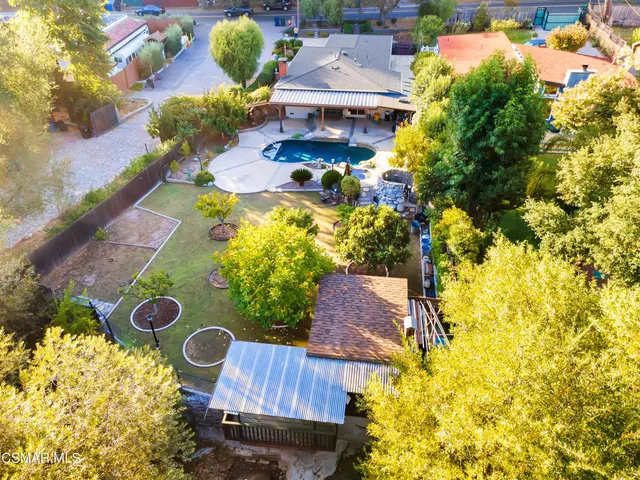 an aerial view of residential house with outdoor space and parking