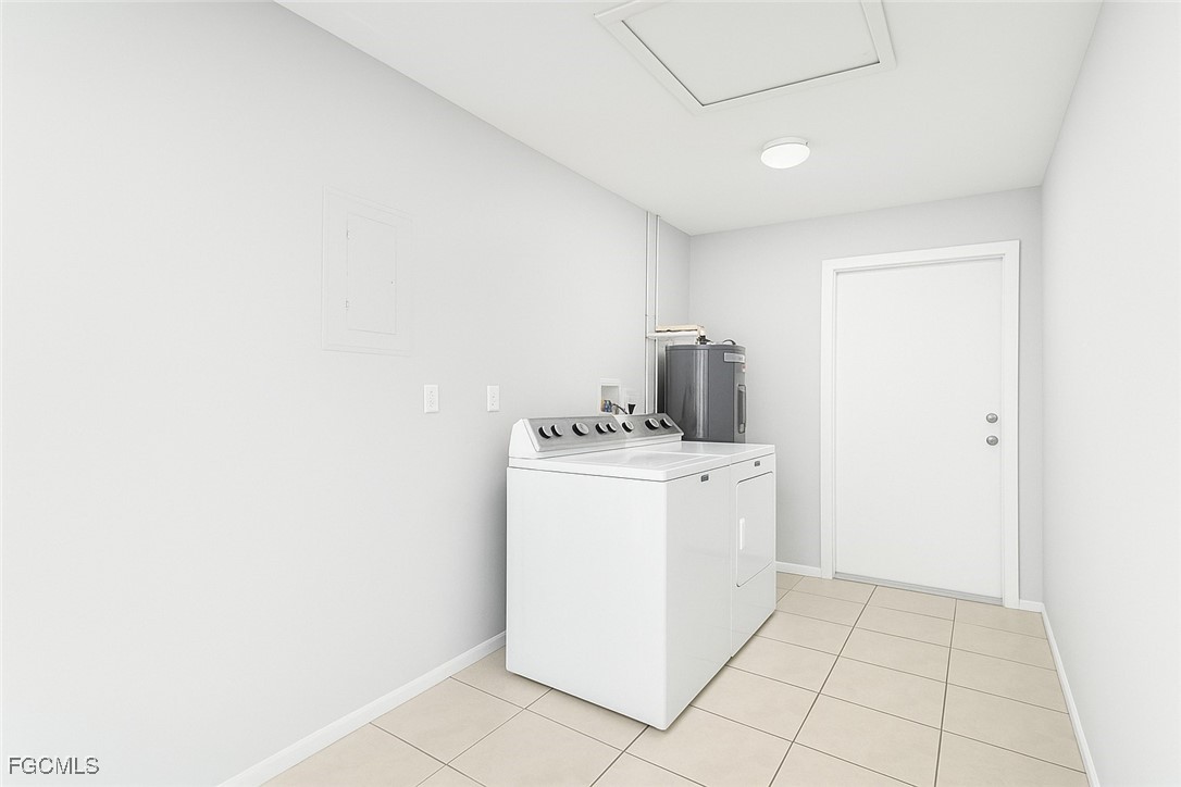 4532 Southwest 8th Place, Unit A Cape Coral, FL 33914 - Photo 11 of 14 a utility room with dryer and washer