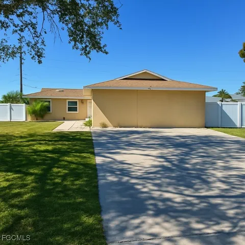 a view of a backyard of the house
