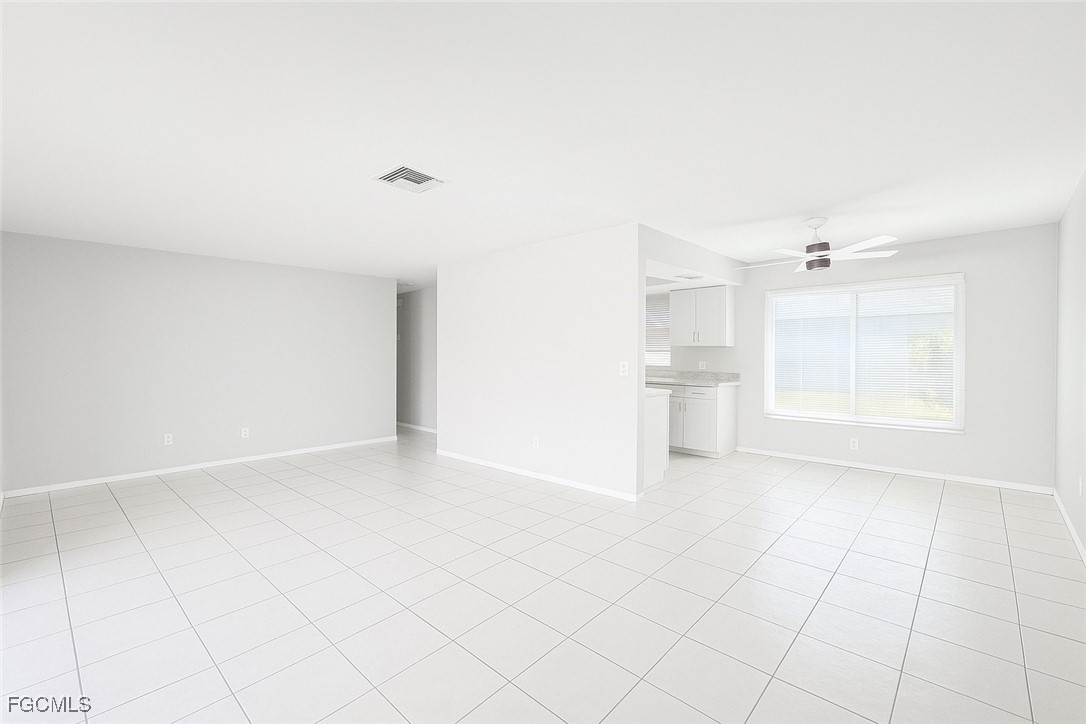 4532 Southwest 8th Place, Unit A Cape Coral, FL 33914 - Photo 5 of 14 a view of an empty room with a window