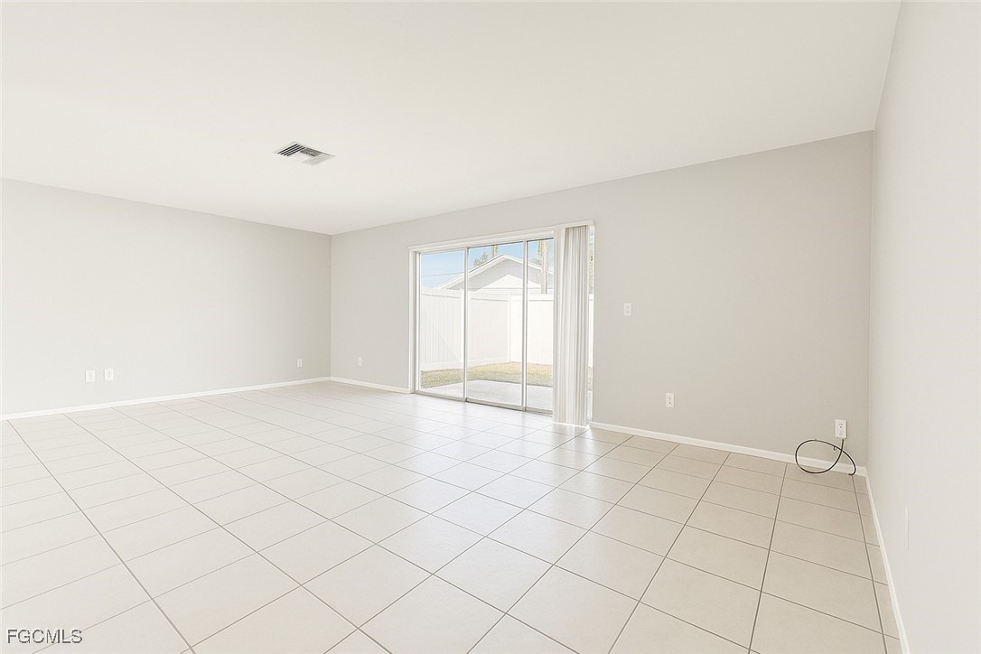 4532 Southwest 8th Place, Unit A Cape Coral, FL 33914 - Photo 6 of 14 an empty room with windows