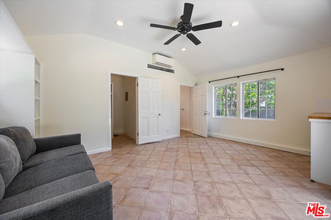14041 Roblar Road Sherman Oaks, CA 91423 - Photo 33 of 47 a living room with furniture and a window