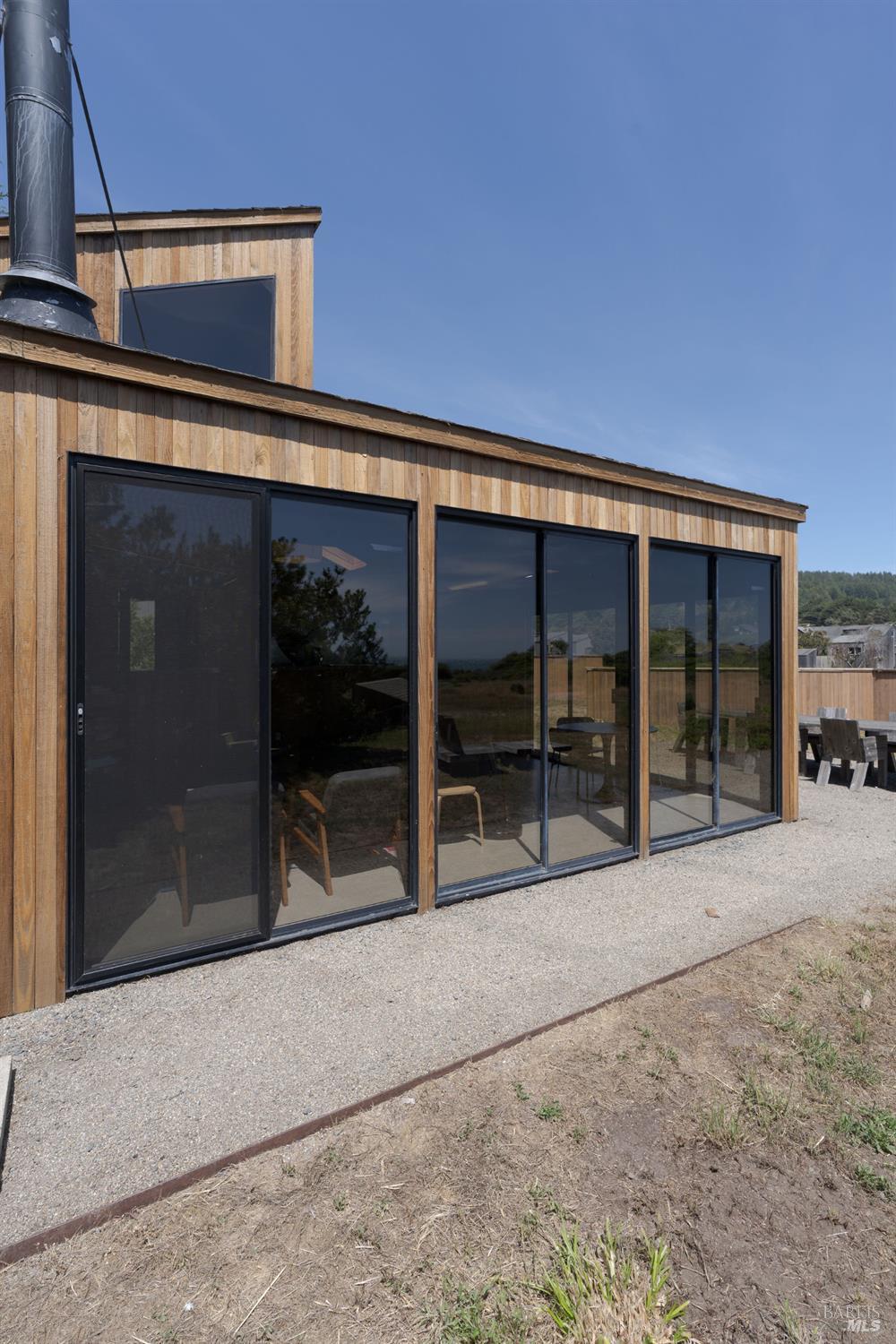 39412 Pacific Reach The Sea Ranch, CA 95497 - Photo 4 of 31 a view of a car garage with a chair
