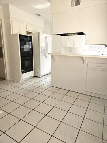 a view of a refrigerator and window