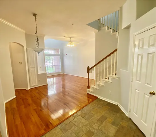 a view of an entryway with wooden floor