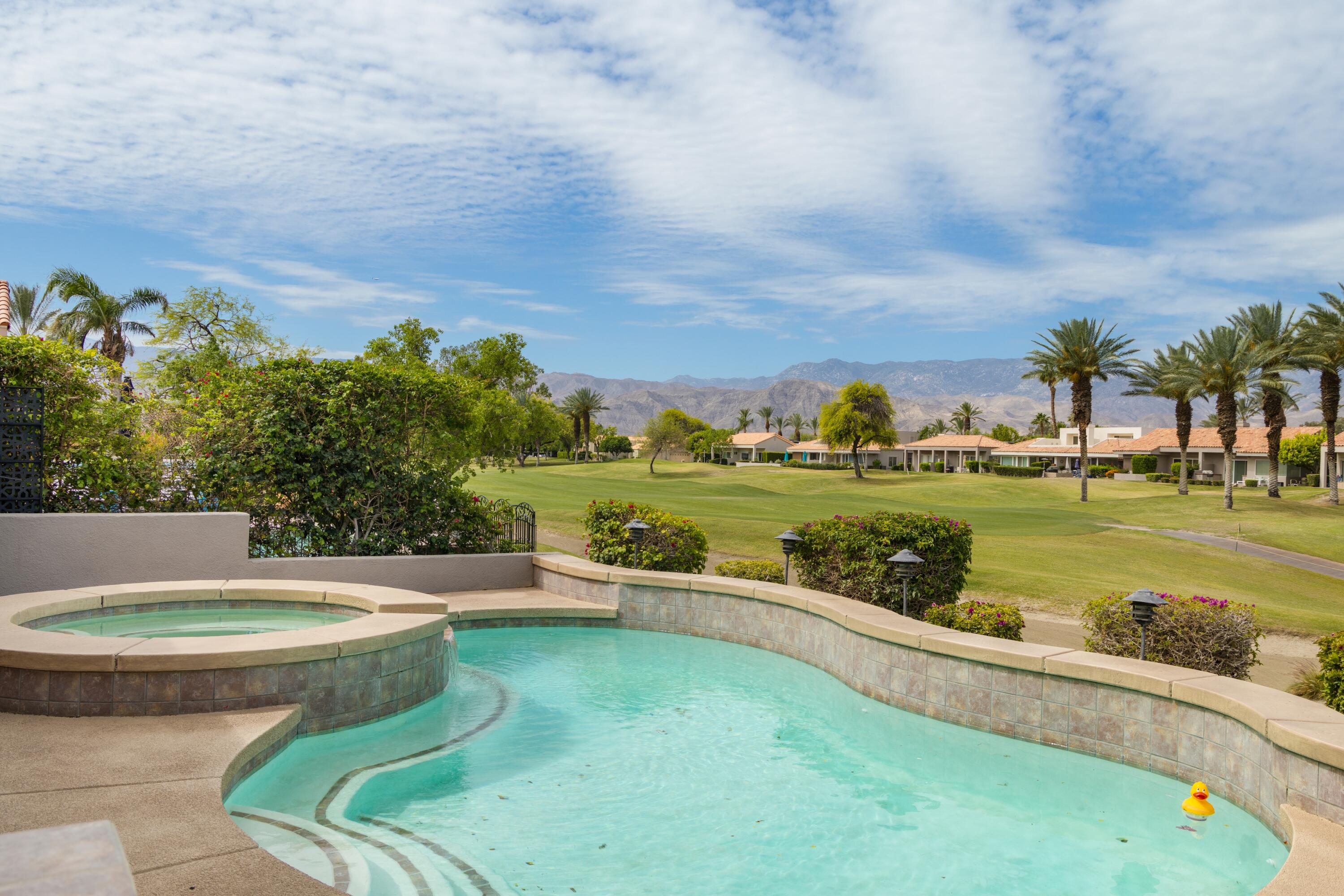 39 Augusta Drive Rancho Mirage, CA 92270 - Photo 3 of 53 a view of a swimming pool and a yard