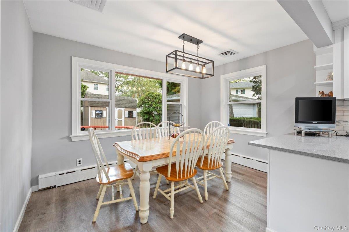 1109 Round Swamp Road Old Bethpage, NY 11804 - Photo 15 of 50 a view of a dining room with furniture window and outside view