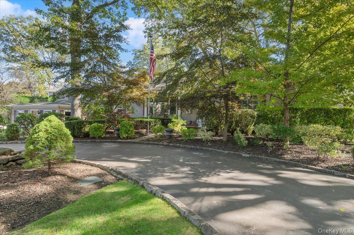 1109 Round Swamp Road Old Bethpage, NY 11804 - Photo 2 of 50 a view of a street with houses on both side