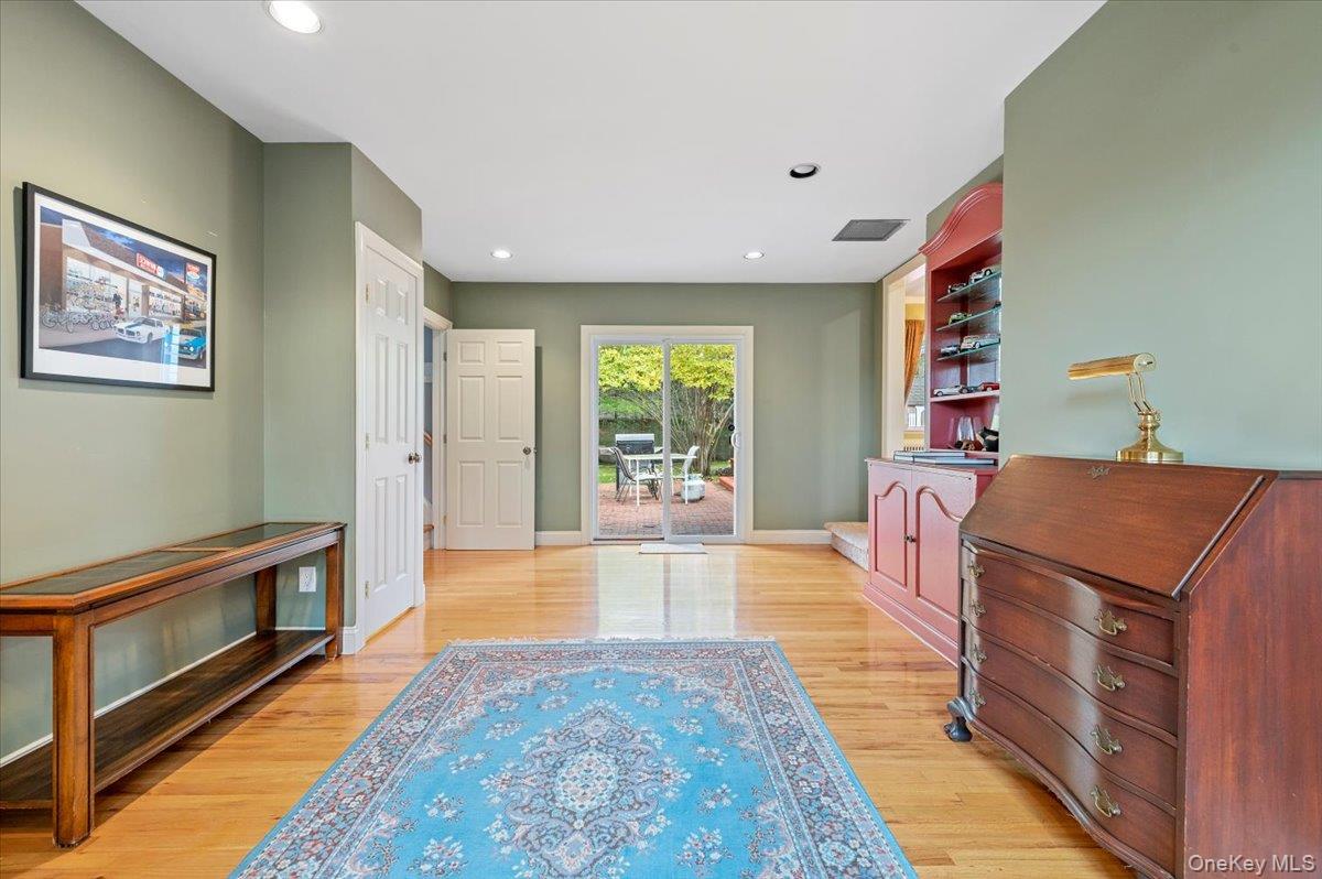 1109 Round Swamp Road Old Bethpage, NY 11804 - Photo 29 of 50 a living room with furniture and a fireplace