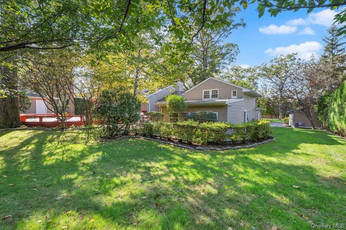 1109 Round Swamp Road Old Bethpage, NY 11804 - Photo 42 of 50 a front view of a house with a yard